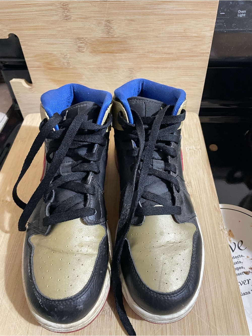 Nike Kids Black and Gold High-Top Sneakers with Blue Lining